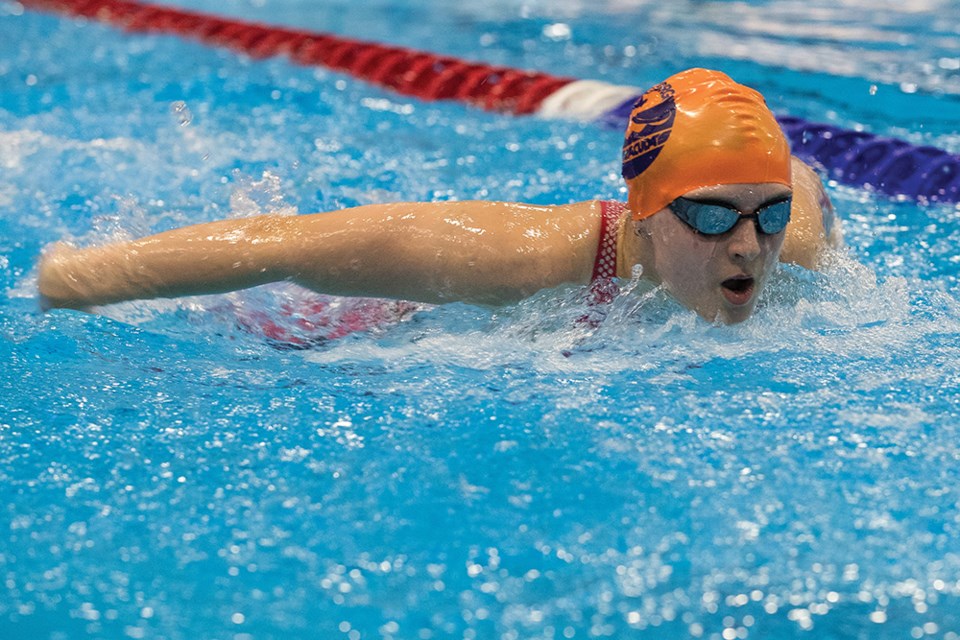 Citizen Photo by James Doyle. Liberty Vaughn glides through the water in a 100m butterfly heat at Prince George Aquatic Centre on Saturday morning during the second day of competition of the Prince George Barracuda Swim Club Dental Moose Meet.