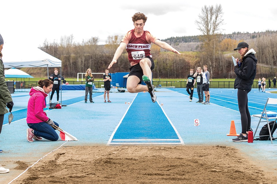 Citizen Photo by James Doyle. Jayden Whitford from North Peace Secondary School flies through the air while competing in the long jump on Saturday morning at Masich Place Stadium in the Prince George Track and Field Club's Sub Zero Meet.