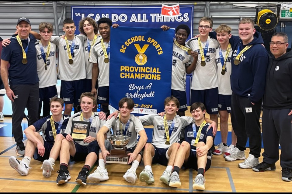 The Cedars Christian Eagles of Prince George celebrate winning the single-A volleyball provincial championship Saturday in North Vancouver.