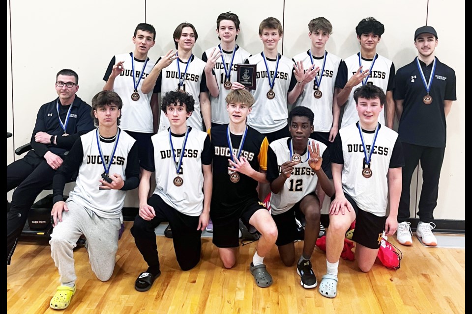The Duchess Park Condors celebrate their bronze medal win at the 24-team BC junior boys volleyball championship Saturday at College of New Caledonia gym.
