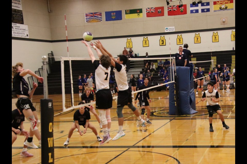 Duchess Park Condors Jeremy Weaver (7) and Esme Long (8) go vertical to put up a block against the College Heights Cougars during the North Central double-A boys volleyball championship. 