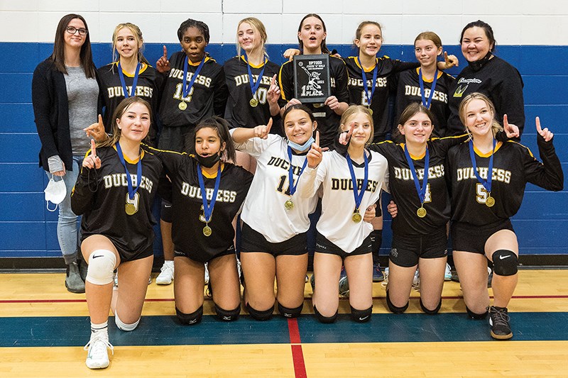 Citizen Photo by James Doyle. The Duchess Park Condors pose for a team photo with their plaque and medals as Junior A girls zone volleyball champions on Saturday evening at D.P. Todd Secondary School gymnasium.