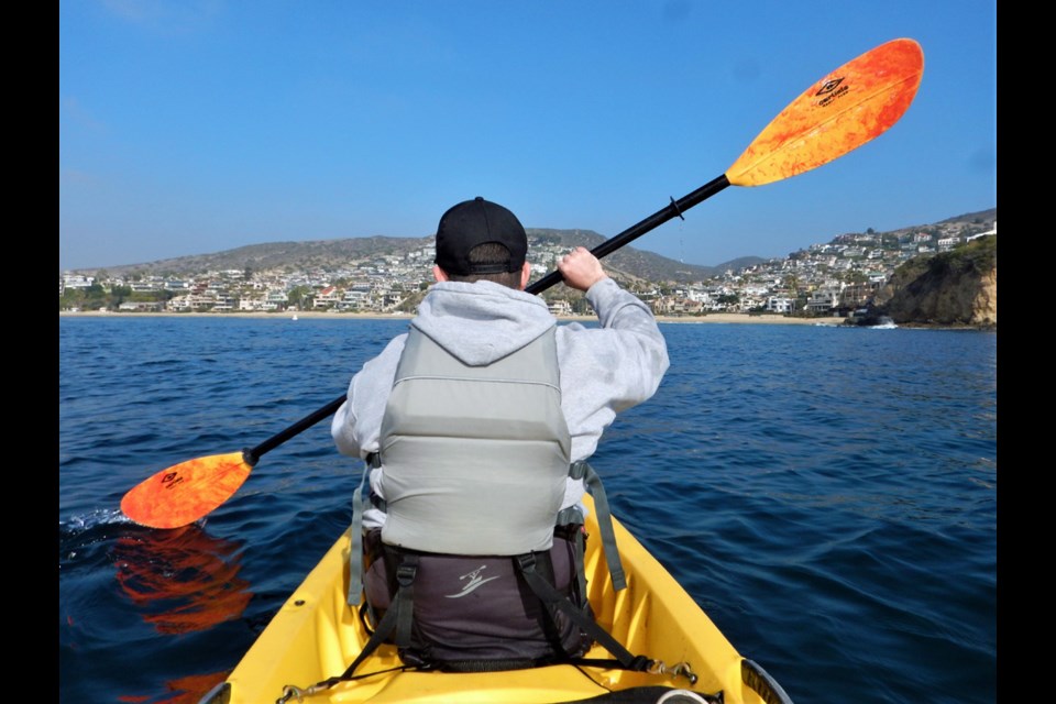 Alex MacNaull takes in the view of Pacific, cliffs, palm trees and swanky waterfront homes on La Vida Laguna's Ocean Kayak Eco Tour in Laguna Beach, California.

Called ‘Laguna Beach’/ cut: The view of Picnic Beach from the cliff top at Heisler Park in Laguna Beach.

Called ‘Capri Laguna hotel’/ cut: The Capri Laguna on the Beach boutique hotel is stacked Mediterranean-style into the side of the cliff at Mountain Road Beach.

Called ‘HangTime roller coaster’/ cut: HangTime is one of the gnarliest roller coaster at Knott’s Berry Farm amusement park in Anaheim.

‘At the hockey game'/ cut: Alex MacNaull, left, and his travel writer dad, Steve, at the Anaheim Ducks-Calgary Flames NHL game on Dec. 3, 2021.