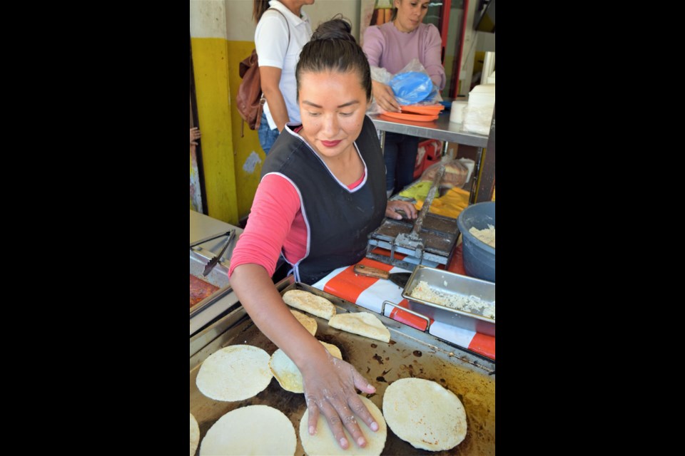 Susanna Morales makes tortillas at Taqueria Morelos.