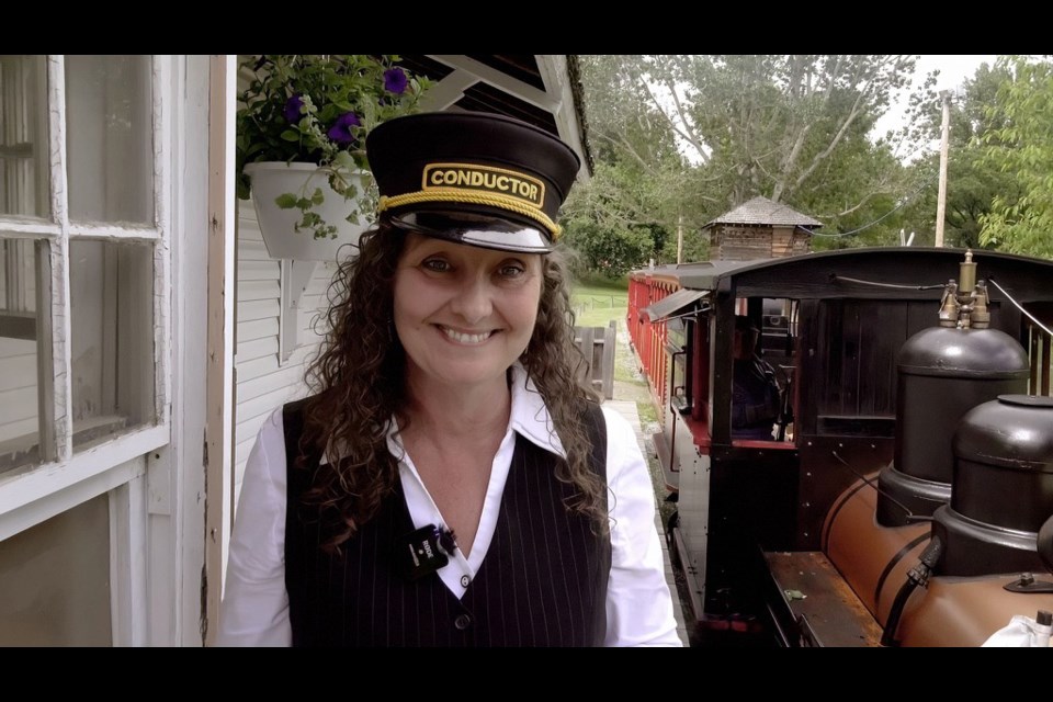 The Exporation Place Museum and Science Centre CEO Tracy Calogheros draws double-duty as a Fort George Railroad conductor featured in the Little Prince segment made by Alberta videographer Peter Hays for the Telus Landmarks video series.