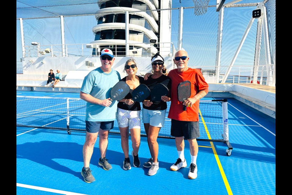 All smiles, from left, Steve and Kerry MacNaull pose with the couple that handily beat them in pickleball -- Marga and Mike Kidd.