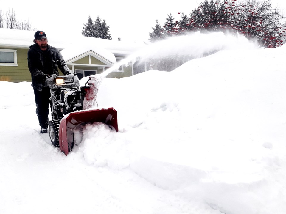 Mike Lee snowblowing