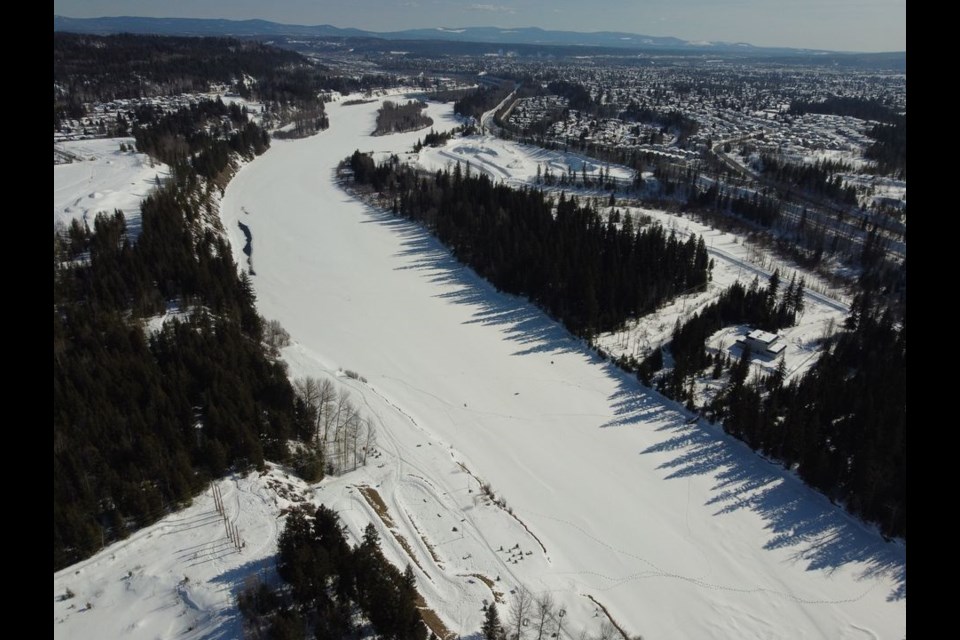 The still frozen Nechako River is captured in this aerial shot, looking southeast towards downtown Prince George.