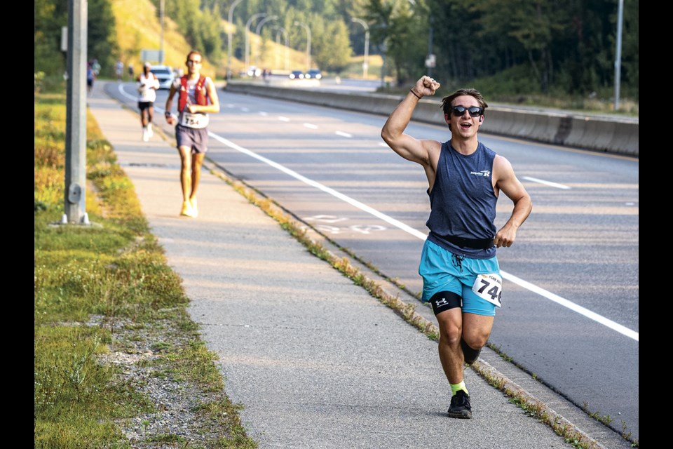 Jacob McInnes leads the runners in the 42.2KM Labour Day Classic up the University Way hill in the early stages of the race Sunday, August 31, 2025.