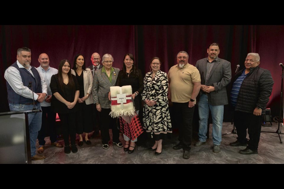 The newly re-elected chief and the eight members of the newly expanded Lheidli T’enneh First Nation council take part in the presentation of a gift from the City of Prince George at the House of Ancestors on Saturday, May 3 after the chief and council were formally sworn in. From left are Coun. Doug Olson, Coun. Kyle McIntosh, Coun. Tasheena Seymour, Coun. Crystal Gibbs, PG city Coun. Garth Frizzell, PG acting Mayor Susan Scott, Chief Dolleen Logan, Coun. Jamie Bird, Coun. Clay Pountney and Coun. Dominic Frederick. The council grew from five to eight members in April’s election because of population growth in the community.