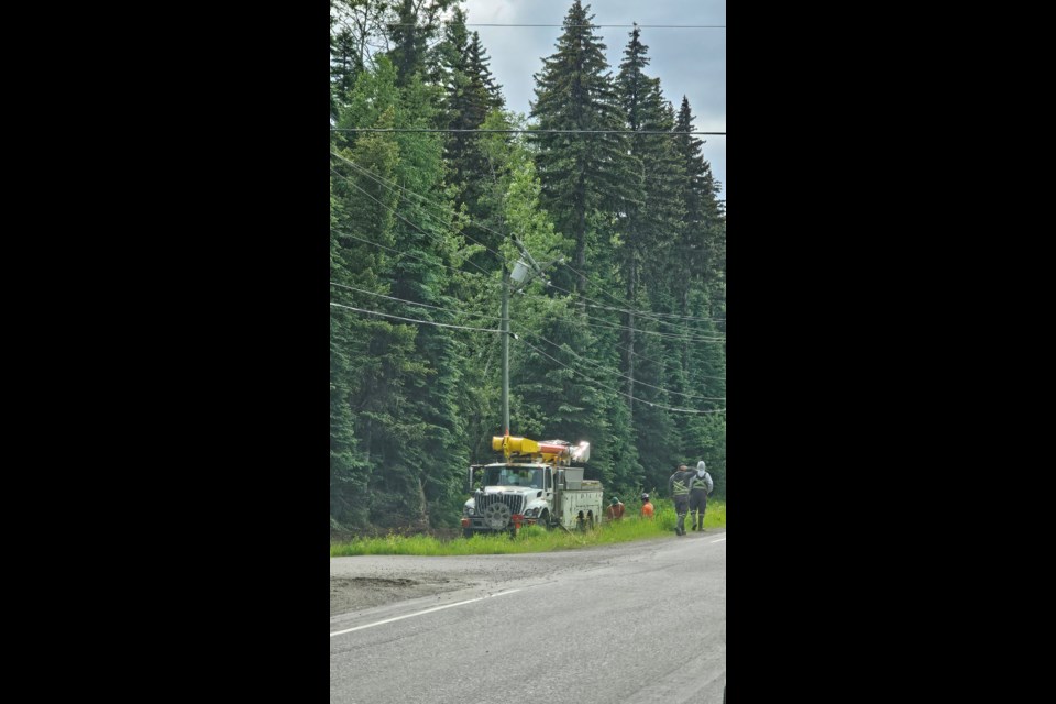 Crews work to repair a hydro pole at Chief Lake Road and Honeymoon Drive on Friday, June 13, 2025 in Prince George, BC. The pole was struck by lightning during a thunderstorm the night before.