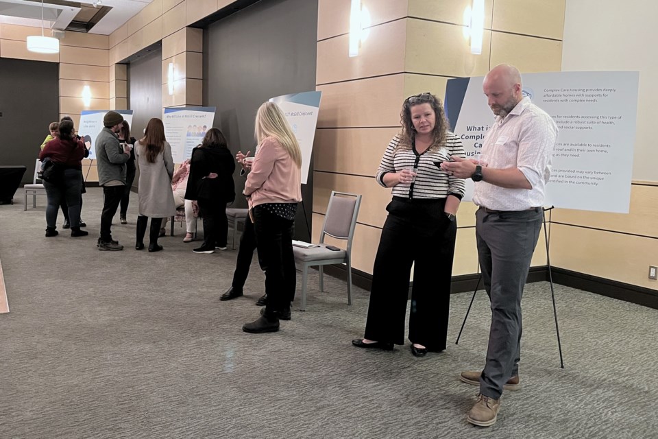 Representatives of Northern Health, Community Living BC and BC Housing chat with neighbourhood residents about a complex care facility planned for 3177 McGill Crescent during an open house at the Prince George Ramada hotel on Wednesday, Feb. 26, 2025.