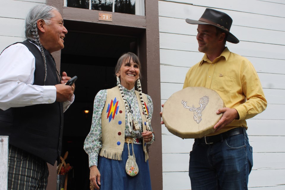 Tourism Minister Spencer Chandra Herbert is gifted a traditional drum by Mike “Sintsé” Retasket on Wednesday, July 9, 2025 in Barkerville, BC.