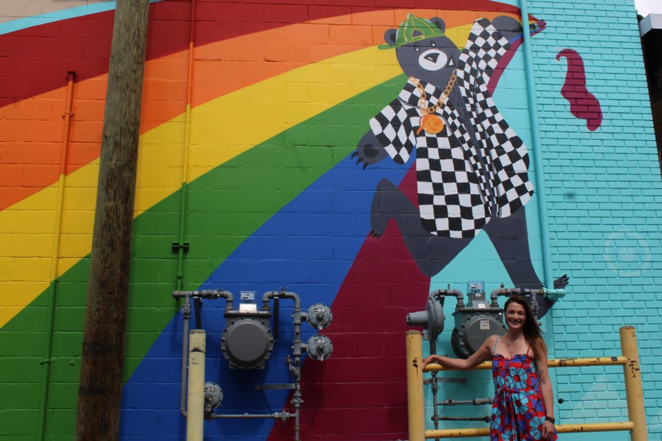 Fernanda Salla poses in front of her artwork on Friday, June 24, 2025 in Prince George, BC.
