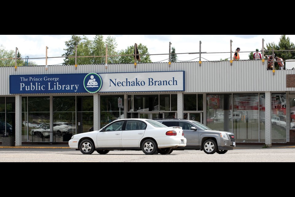 Roofers were hard at work on the roof of the Prince George Public Library Nechako branch on Tuesday. The library in the Hart Centre Mall will be closed until work on the roof is completed.