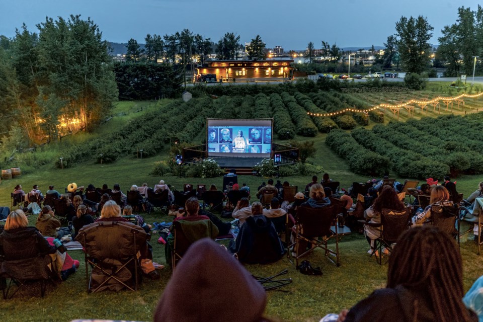 The audience has a great view of the movie, the orchard and the winery from the terraced grass of the Northern Lights Winery's Orchard View Amphitheater for Friday night's showing of Romeo and Juliet starring Leonardo DiCaprio and Claire Danes.