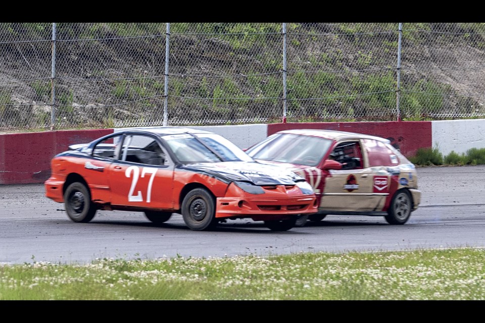 Hornet class racer No. 12 Reid Bueckert T-bones No. 27 Sierra Trenholm after she spun in Turn 3 during their dash at PGARA Saturday night. Both cars and drivers were able to continue on with the evening's racing.
