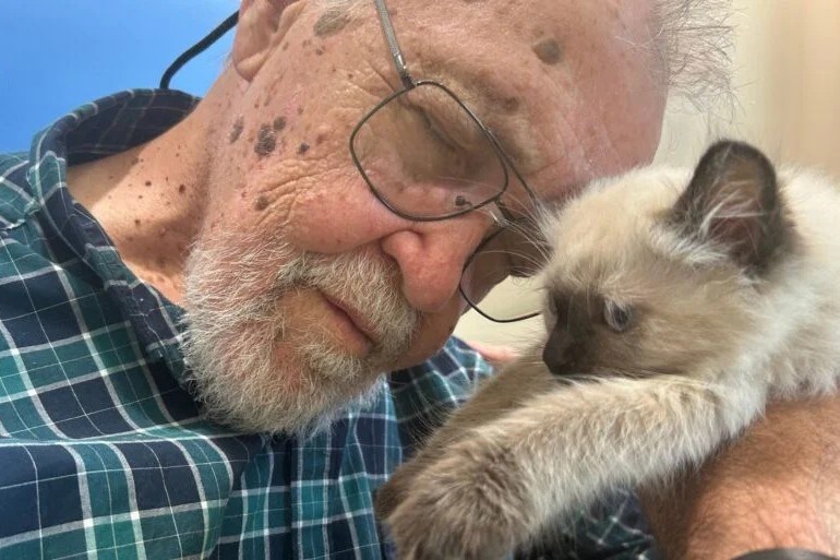 A resident of the Providence Living facility in Comox embraces a new furry friend 