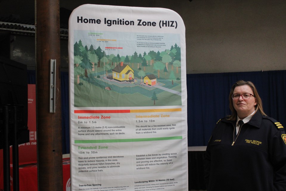 Tanya Spooner offers visitors information about safety at the Emergency Reception Centre booth at Pine Centre on Thursday, March 27, 2025 In Prince George, BC.