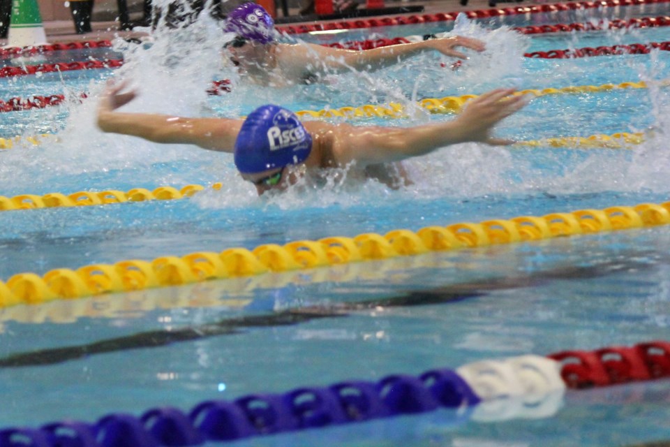 Finn Boyle races in the 200-metre prelim race at Regionals.
