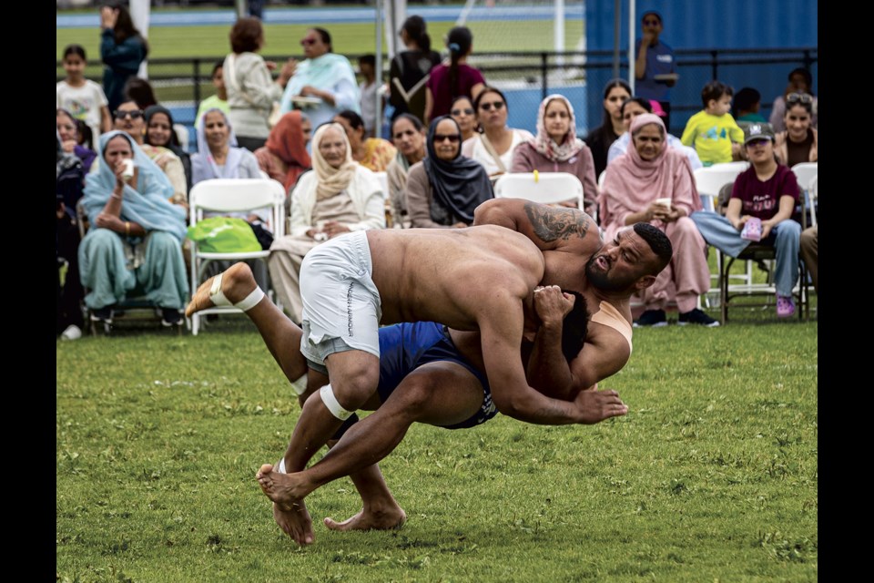 A Grande Prairie defender takes down an Abbotsford raider during a Kabaddi match at the PG Annual Punjabi Cultural Event held at the PGSS fields Saturday and Sunday, July 5-6, 2025.