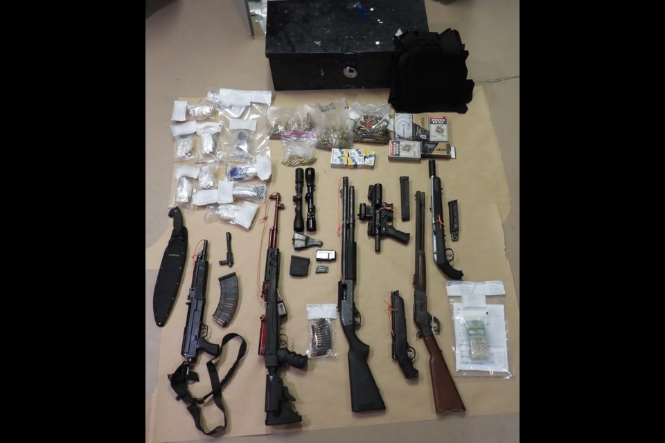 RCMP display some of the weapons and drugs found in a Quince Street home Nov. 29. 