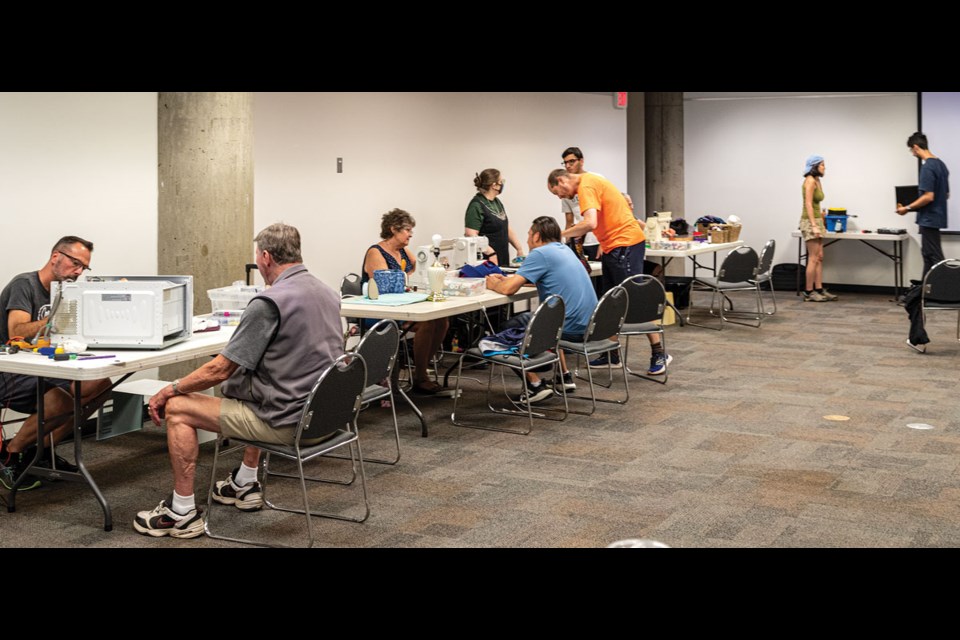 Members of Eco Living Community hosted a Repair Cafe: Small Appliances at the Prince George Public Library Saturday afternoon with volunteers attempting repairs on everything from lamps to an XBox and even curtains.