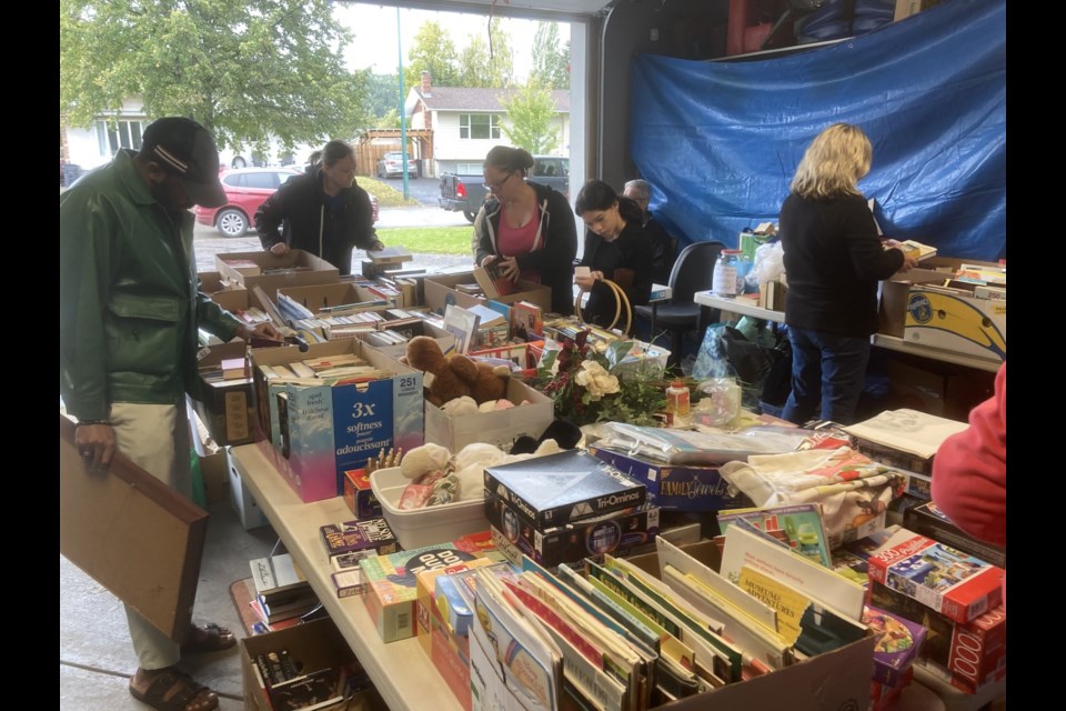 Browsers check out the deals at the Legion 43 Mega Garage and Book Sale on Saturday, Sept. 21, 2024 in Prince George, BC. The sale continues Sunday, 8 a.m.-4 p.m.