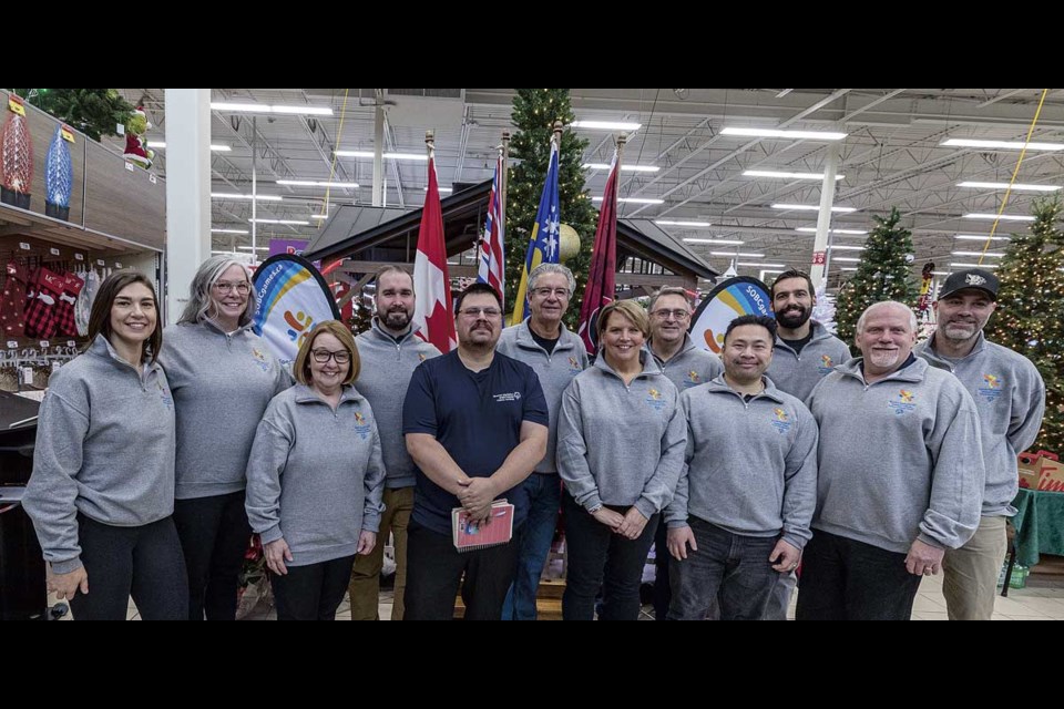 Members of the 2025 Special Olympics BC  Summer Games organizing committee, provincial executives and local athlete Adam Spokes take part in the official launch Tuesday at Canadian Tire. 

