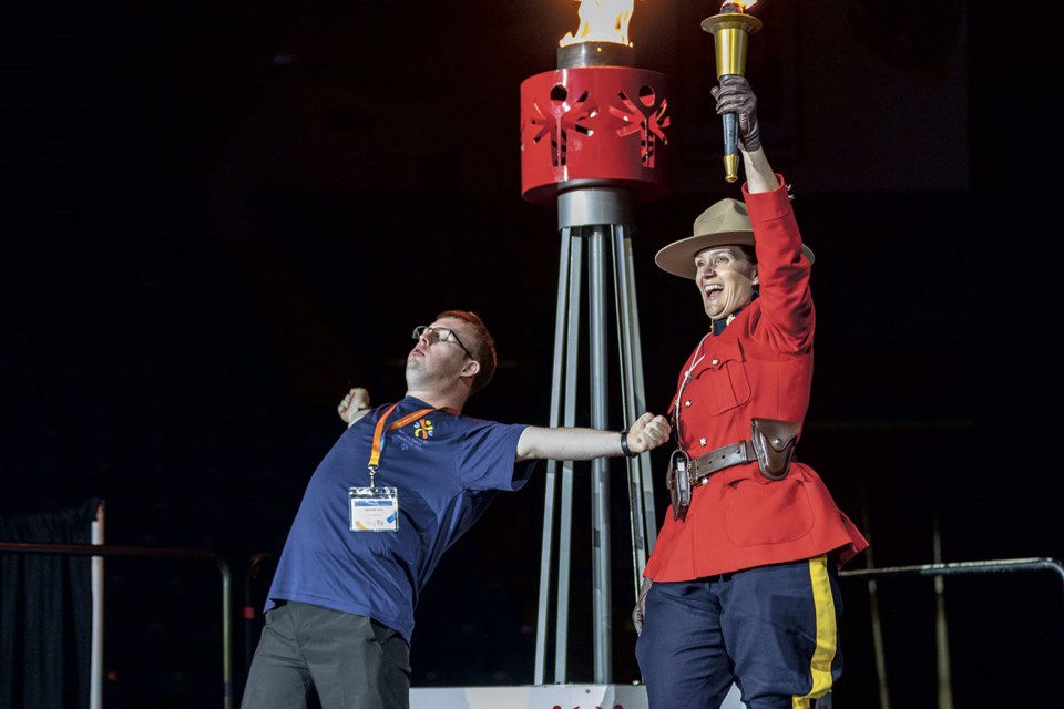Region 8 (Cariboo - North East) 10-pin bowler Gregory Cole and RCMP Cpl. Jennifer Cole celebrate after lighting the cauldron at CN Centre during the Special Olympics BC Summer Games opening ceremony on Thursday, July 10, 2025.
