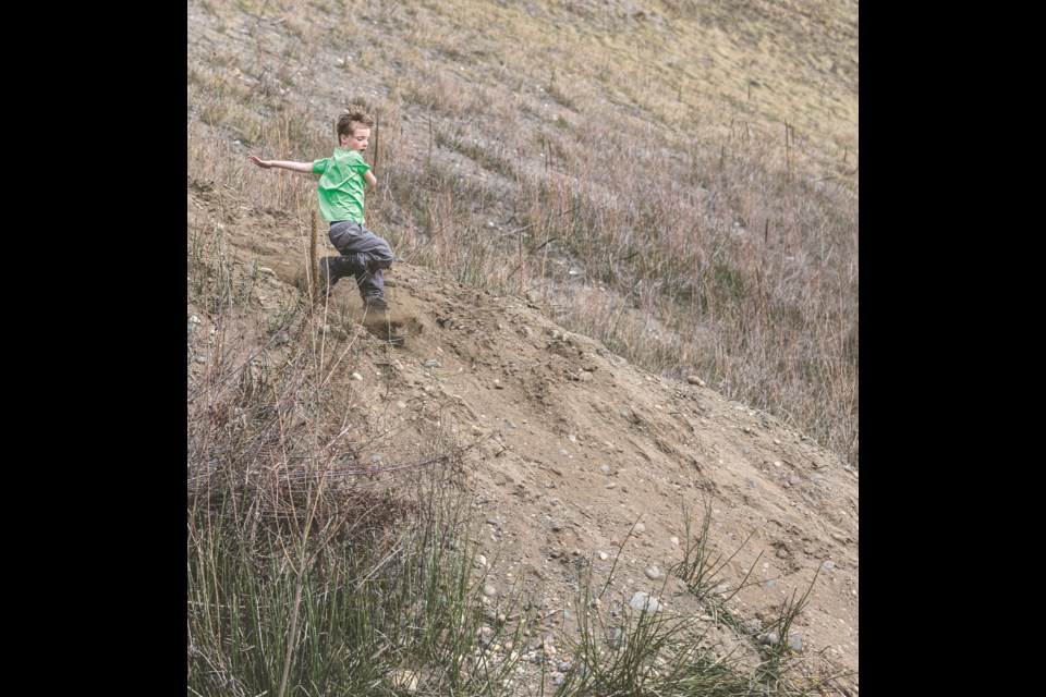 Isaiah Sims, 7, racing down the Cutbanks after climbing up with his father and younger brother following church Sunday, April 13, 2025. When asked if it was fun Isaiah replied "Maybe a bit too much fun!"