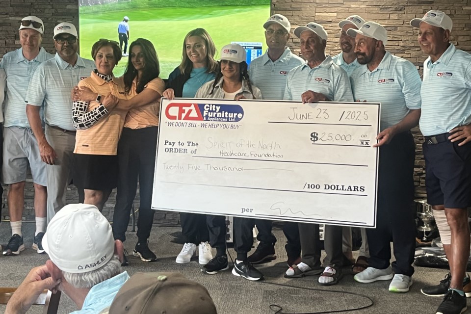 Aimee Cassie CEO of Spirit of the North Healthcare Foundation, fifth from the left, accepts the donation cheque of $25,000 from RK Furniture Gallery, Ashley Furniture, City Furniture and RBC representatives on Monday, June 23 during the Spirit's 25th annual golf tournament held at Prince George Golf & Curling Club.