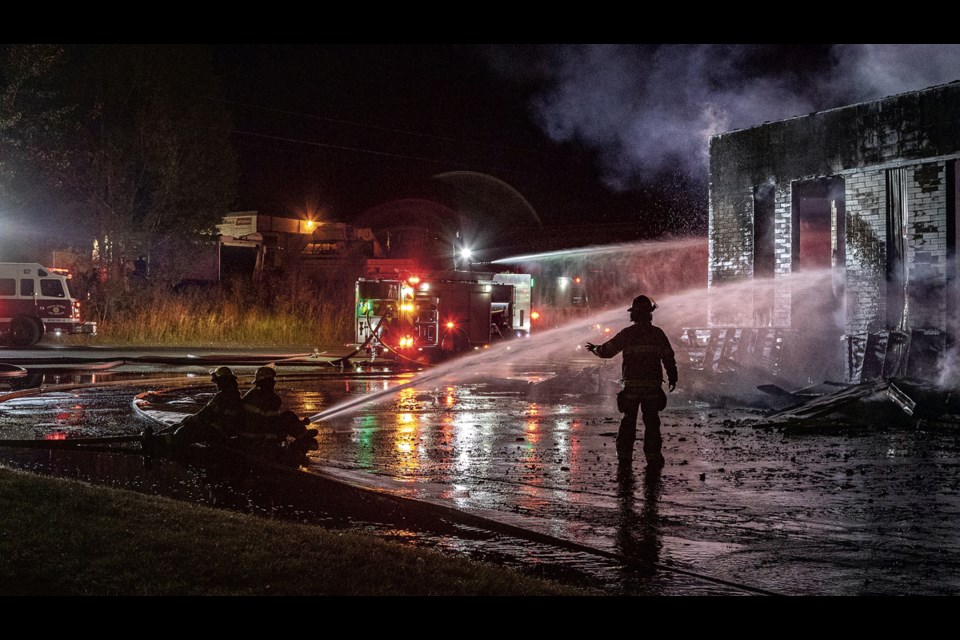 Prince George Fire/Rescue crews work on a blaze that broke out at Spotlight Uniforms and Linens on the Hart Highway on Tuesday, Aug. 5, 2025 at about 9 p.m. The building was consumed by the fire but there were no reports of casualties.