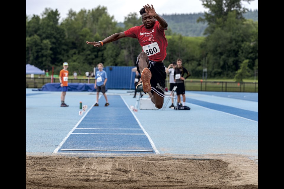 Kasieobi Udumaga competes in the long jump at the Spruce Capital Track Meet Saturday at Masich Place Stadium. 