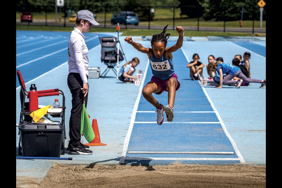 Meriam Aka, 9, competes in the long jump at the Spruce Capital Track and Field meet at Masich Place Stadium Saturday, June 14, 2025.