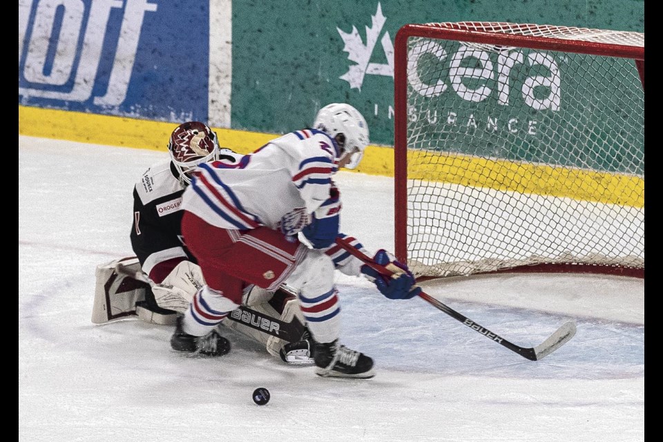 Chiefs goalie Quentin Miller bats away the breakaway shot of Spruce Kings forward Kazumo Sasaki in the first period of the third game of their playoff series Tuesday, April 8, 2025 at Kopar Memorial Arena.