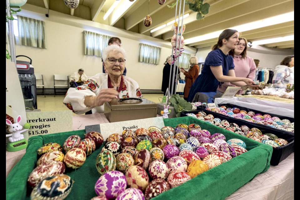 Beth Pawluk prepares to sell Pysanky, Ukrainian Easter eggs, and frozen perogies at the St. George's Easter Bazaar in the basement of Ukrainian St George's Catholic Church Saturday, April 12, 2025. 