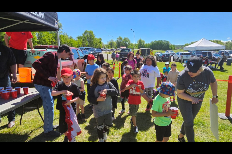 Students from Nusdeh Yoh Elementary School in Prince George take part in the Juvenile Sturgeon Release on Friday, June 7, 2024 in Vanderhoof, B.C. The annual event is part of the Nechako White Sturgeon Recovery Initiative.
