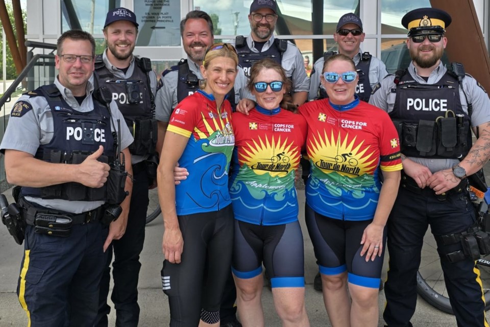 Tour De North riders and members Prince George RCMP pose for a picture at the training ride in memory of fellow rider Shane Kelly, who died on after being hit by a truck while training on July 10, 2025.