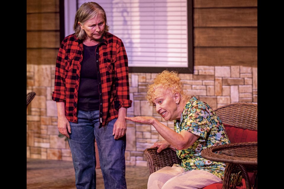 Ivy Hoffbauer (seated), actor Kathryn Kerbes, explains to Doris Mooney, actor Julia Mackey, how things are for her in Canadian playwright Norm Foster's Doris and Ivy In The Home during rehearsal Thursday, April 17, 2025.