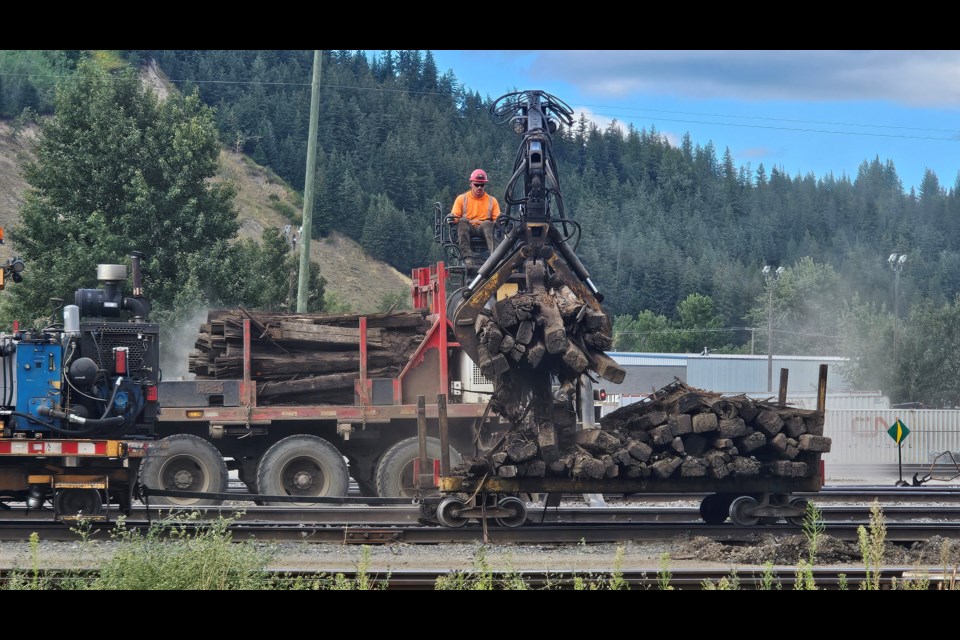 CN workers remove old ties while carrying out track maintenance along First Avenue on Wednesday, Aug. 13, 2025 in Prince George, BC.