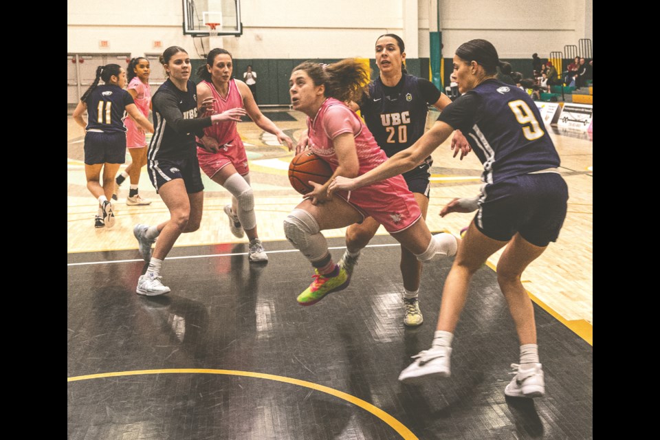 UNBC Timberwolves guard Yana Shupak leaps through the blocks of UBC Thunderbirds during a game on Feb. 14, 2024 at Brownridge Court.