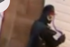 A suspect is seen spraypainting a home on the 100 block of McQueen Crescent.