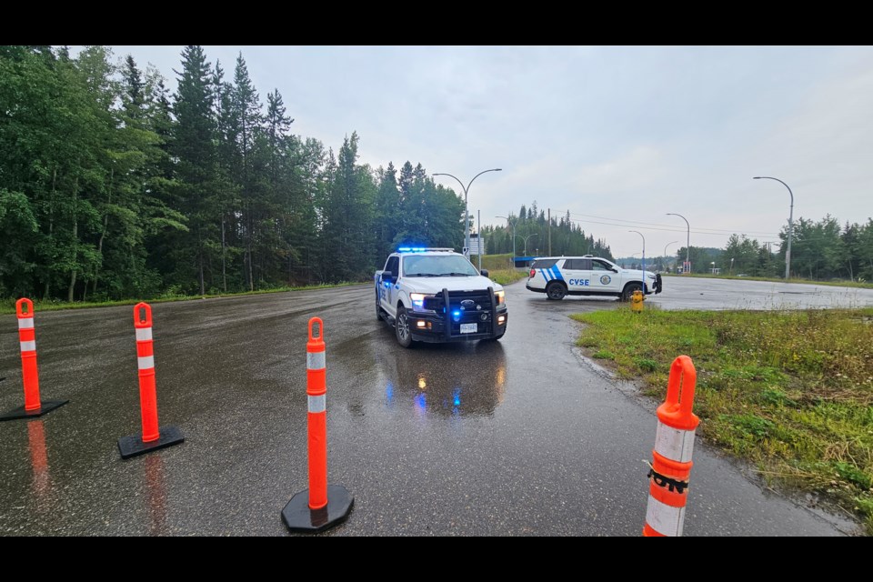 CVSE vehicles and bollards block the entrance and exit to the Hart weigh scales station on Monday, July 21, 2025 in Prince George, BC.