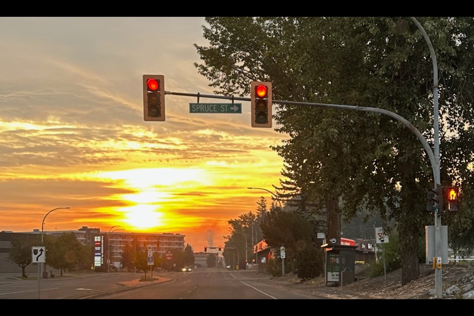 Wildfore smoke drifts over Prince George, BC as the sun rises on Tuesday, Aug. 4, 2025.