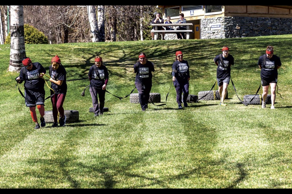 The seven person team from Harwin Elementary drag tires up a hill and back in the 5km Zulu Challenge at Lheidli T'enneh Memorial Park Saturday, April 26, 2025.