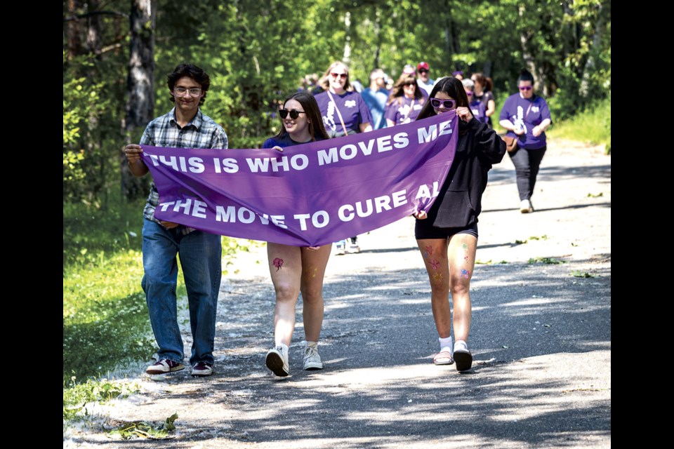 Milo Sanchez, 13, (left) Sadie Francis, 15, and Lucy Lafontaine, 14, lead the way ALS walkers along the paths at Lheidli T'enneh Memorial Park Sunday, June 22, 2025.