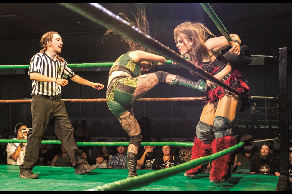 Primetime Wrestling referee Freddy Falcon trys to stop "The Vixen" Jade from repeatedly kicking Riea Von Slasher in the stomach during Primetime Wrestling's Main Event at the Kin Centre on Saturday, May 4, 2024 in Prince George, B.C.