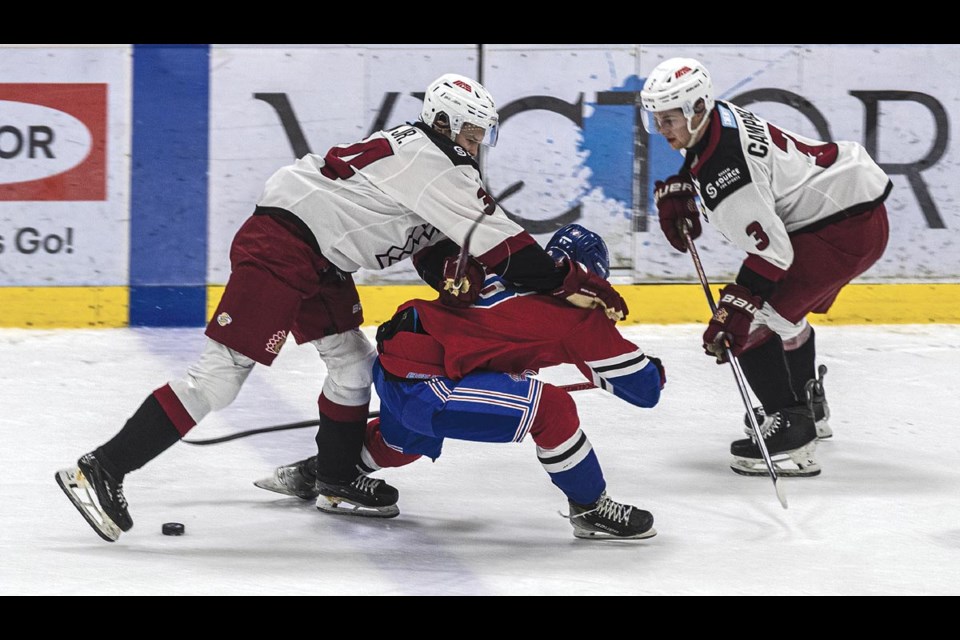 Chilliwack Chiefs forward Dwayne Jean Jr. pushes Spruce King Cooper Williams off the puck Saturday Feb 22 at Kopar Memorial Arena.