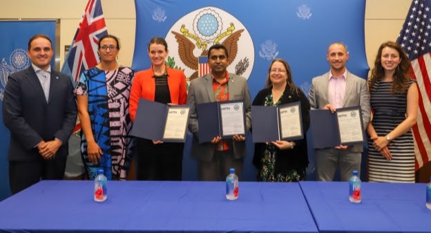 Representatives of the U.S. Trade and Development Agency, the Global Green Growth Institute and the government of Fiji were joined by Nathan Johnson (second from right) and Elena van Hove (far right) from Arizona State University’s Laboratory for Energy And Power Solutions at a signing ceremony in Suva, Fiji, on May 17, 2023. The event marked the launch of an ASU-led solar energy project to expand access to reliable and affordable electricity among rural communities across that Pacific Island nation.